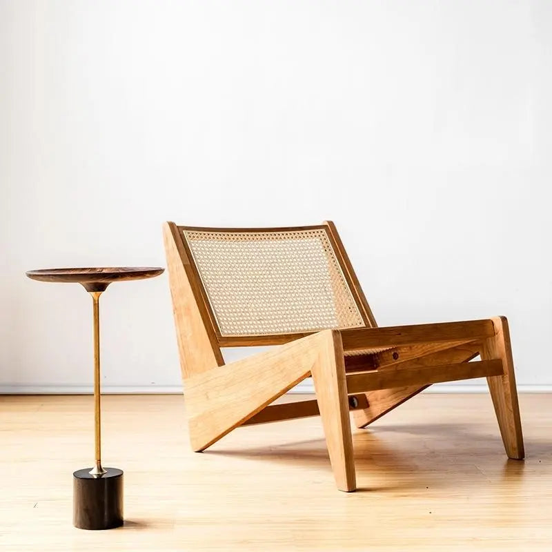 Stylish accent chair with a rattan backrest: A staple of the East meets modern design trends